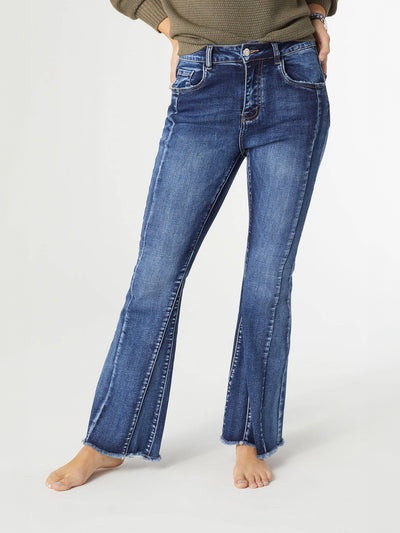 Close-up image of a woman wearing EverStretch flare jeans featuring a high-rise fit, inset seam detail, and fringed bottom. The jeans show a comfortable, stretchy fit ideal for casual or semi-formal outfits.