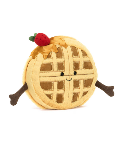 Introducing the Jellycat Amuseables Rene Waffle—a round, plush toy made from soft polyester fibers, featuring a delightful grid pattern, small arms, and topped with a silky syrup hat and plush red strawberry.