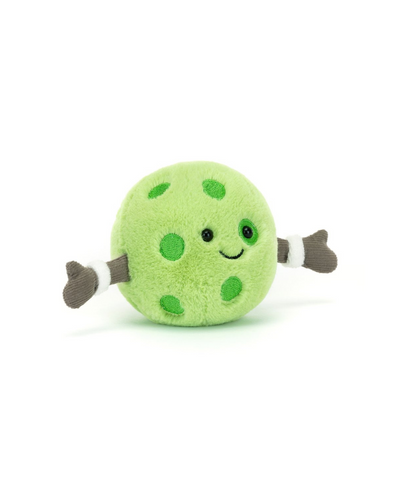 The Jellycat Amuseables Sports Pickleball is a round, green plush with dark green spots, gray arms, black eyes, and a smiling mouth—perfect for adding fun to your next Game Day or pickleball match.
