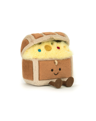 The Jellycat Amuseables Treasure Chest is a plush toy shaped like a treasure chest, featuring fuzzy gold-look fabric, colorful jewel-like accents, a smiling face, and soft brown legs.