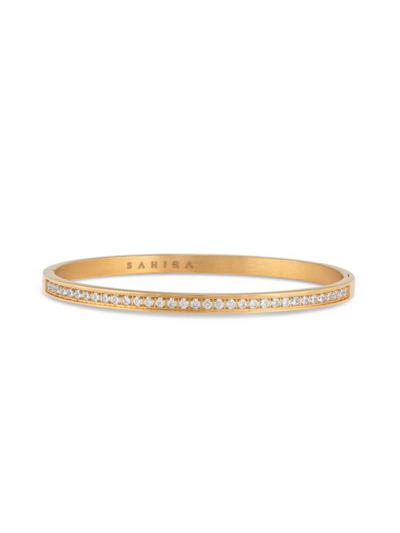 A sleek gold bangle bracelet encrusted with sparkling pavé crystals. The bracelet is minimalist and elegant, suitable for both casual and formal occasions.