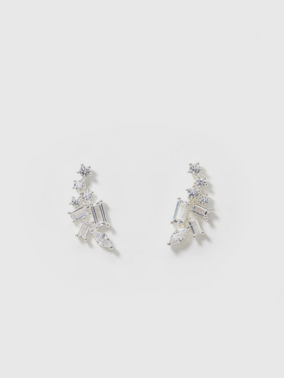 Silver climber earrings with sparkling cubic zirconia stones in marquise and baguette shapes, arranged in a cascading design against a white background.