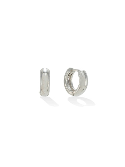 Two silver-plated huggie hoop earrings, one closed and one slightly open, displaying their shiny finish and simple, curved design.